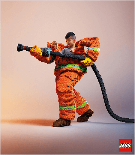 Това е снимка от LEGO реклама, на която се вижда младо азиатско момче в пожарна униформа, изработена от LEGO. Униформата е оранжева с неонова зелена ивица около маншетите на палтото и панталона. Пожарникарят стои с един крак назад и държи пожарникар, също направен от лего. Главата на момчето се появява от горната част на униформата, която е много по-голяма от него и спира около раменете. Снимката е направена на обикновен неутрален фон. Логото LEGO се появява в червено поле в долния десен ъгъл. Талия Улф казва, че LEGO е чудесен пример за марка, която използва емоции в рекламата.